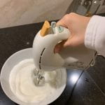 Mixing the egg whites until forming stiff peaks